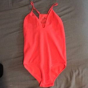 Vibrant pink bodysuit (free people)